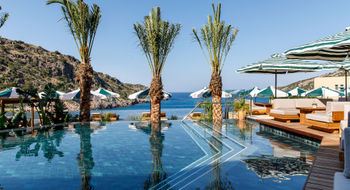The main pool at Crete’s Daios Cove has the scenic Vathi Bay as its backdrop.