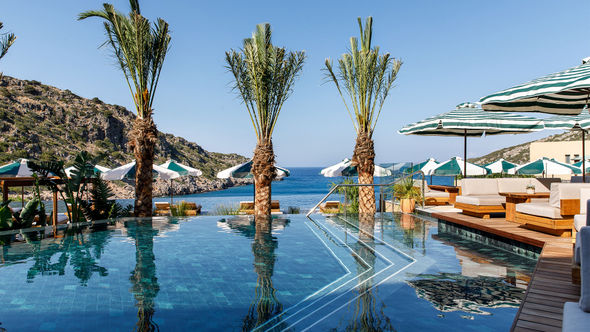 The main pool at Crete’s Daios Cove has the scenic Vathi Bay as its backdrop.