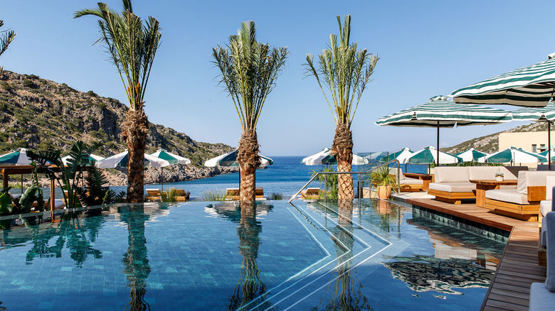The main pool at Crete’s Daios Cove has the scenic Vathi Bay as its backdrop.