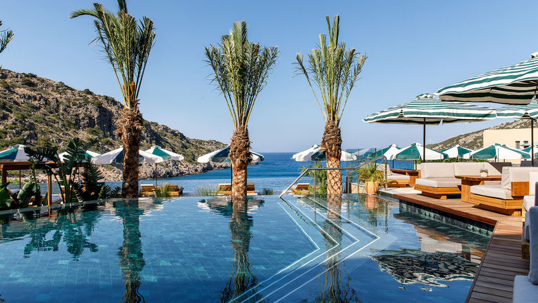 The main pool at Crete’s Daios Cove has the scenic Vathi Bay as its backdrop.