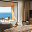 All accommodations include a private balcony with a heated pool.