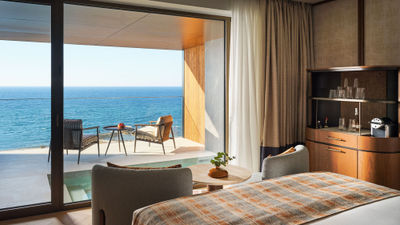 All accommodations include a private balcony with a heated pool.