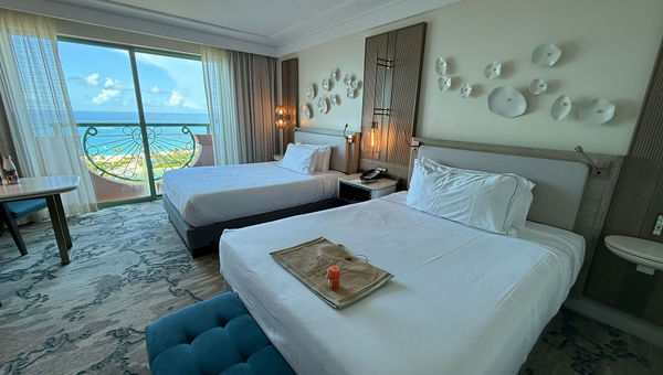 A Royal Towers double queen room. The rooms were updated in 2023 as part of the resort's 25th anniversary. A Royal Towers double queen room. The rooms were updated in 2023 as part of the resort's 25th anniversary.