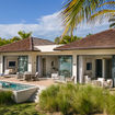 A two-bedroom oceanfront bungalow features indoor-outdoor living areas, private plunge pools and direct beach access.