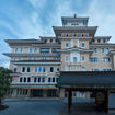 The stately entrance of the Imperial Hotel Kyoto, with the Gion Kobu Kaburenjo theater where geiko and maiko perform.