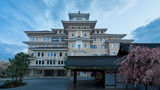 The stately entrance of the Imperial Hotel Kyoto, with the Gion Kobu Kaburenjo theater where geiko and maiko perform.