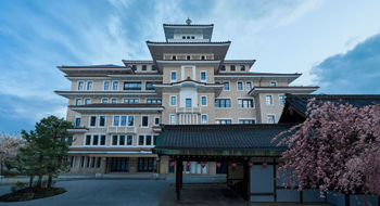 The stately entrance of the Imperial Hotel Kyoto, with the Gion Kobu Kaburenjo theater where geiko and maiko perform.