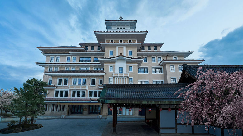 The stately entrance of the Imperial Hotel Kyoto, with the Gion Kobu Kaburenjo theater where geiko and maiko perform.