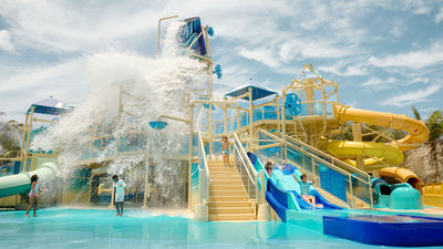 Great Tides Waterpark will feature a children's splash area with multiple waterslides and water spraying from above.