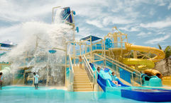 Great Tides Waterpark will feature a children's splash area with multiple waterslides and water spraying from above.