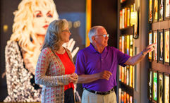Guests touring the Dolly Album Hall at Dollywood's DreamMore Resort and Spa.