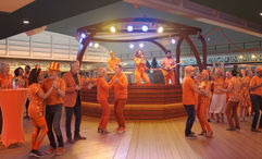 Poolside bandstands will be used for Holland America Line's signature Orange Party.