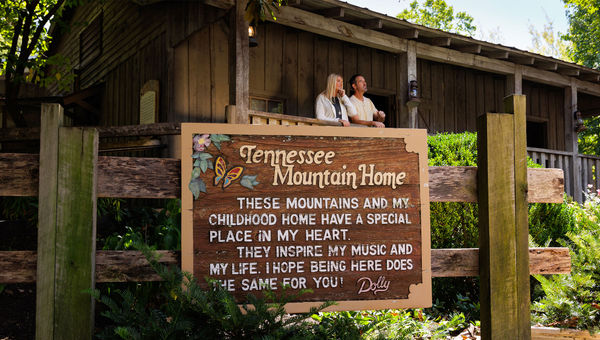 A replica of Dolly Parton's childhood cabin is in the Rivertown Junction section of Dollywood.