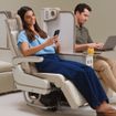 The electric privacy divider extends to the full height of the seat.