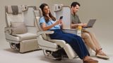 The electric privacy divider extends to the full height of the seat.