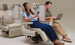 The electric privacy divider extends to the full height of the seat.