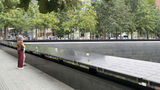 Twenty-five years after the 9/11 attacks, visitors arrive at the reflecting pools at the 9/11 Memorial & Museum that were built in the footprints of the twin towers.