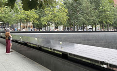 Twenty-five years after the 9/11 attacks, visitors arrive at the reflecting pools at the 9/11 Memorial & Museum that were built in the footprints of the twin towers.