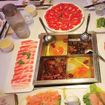 The table is set for a meal at Da Miao Hotpot in Chengdu's Kuanzhai Alley, an area of the Chinese city with a vibrant street culture.