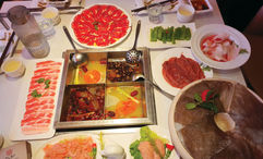 The table is set for a meal at Da Miao Hotpot in Chengdu's Kuanzhai Alley, an area of the Chinese city with a vibrant street culture.