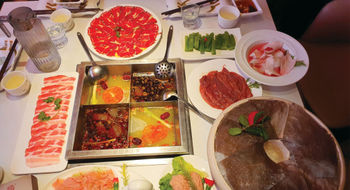 The table is set for a meal at Da Miao Hotpot in Chengdu's Kuanzhai Alley, an area of the Chinese city with a vibrant street culture.