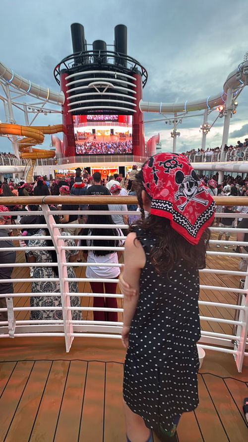 Disney Cruise Line provides guests with red bandanas for the pirate night party on the Disney Wish. Disney Cruise Line provides guests with red bandanas for the pirate night party on the Disney Wish.