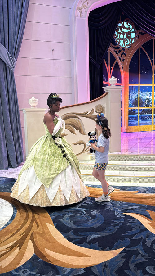 The author's daughter chats with Tiana from "The Princess and the Frog." The author's daughter chats with Tiana from "The Princess and the Frog."