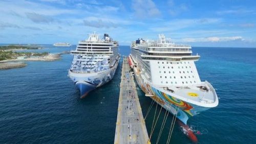 Two ships docked at the pier at Great Stirrup Cay.