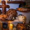 Round, sweet bread called pan de muerto is made for Dia de Muertos.