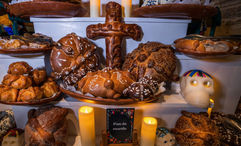 Round, sweet bread called pan de muerto is made for Dia de Muertos.