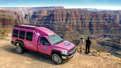 The custom climate-controlled Jeep includes leather captain's chairs and oversized windows.