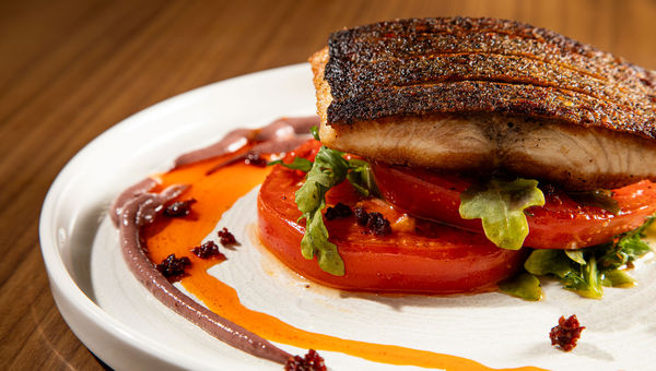 On the menu at Isolana is the pan-seared kanpachi with Kamuela tomatoes. On the menu at Isolana is the pan-seared kanpachi with Kamuela tomatoes.