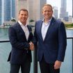 Sandals executive chairman Adam Stewart (left) with Royal Caribbean Group CEO Jason Liberty.