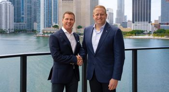 Sandals executive chairman Adam Stewart (left) with Royal Caribbean Group CEO Jason Liberty.