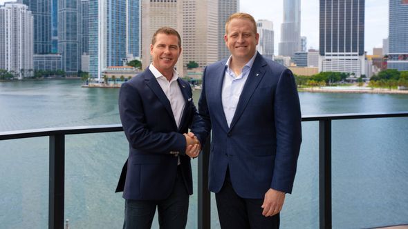 Sandals executive chairman Adam Stewart (left) with Royal Caribbean Group CEO Jason Liberty.
