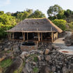 A thatched suite at Upeo Serengeti, built into a granite kopje above Kogatende in the northern Serengeti.