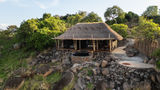 A thatched suite at Upeo Serengeti, built into a granite kopje above Kogatende in the northern Serengeti.