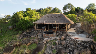 A thatched suite at Upeo Serengeti, built into a granite kopje above Kogatende in the northern Serengeti.
