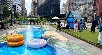 A 3D chalk mural of the lazy river at Disney’s Lakeshore Lodge, created by street artist Tracy Lee Stum.