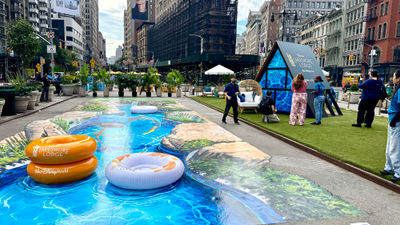 A 3D chalk mural of the lazy river at Disney’s Lakeshore Lodge, created by street artist Tracy Lee Stum.