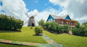 Trois Rivieres Distillery is recognizable by its landmark windmill.