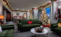 The Christmas Suite at Westgate Las Vegas Resort and Casino has three festively decorated trees along with traditional lights, garlands and an electric fireplace.