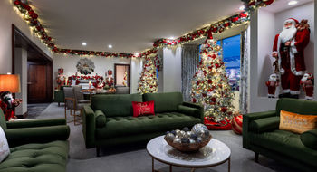 The Christmas Suite at Westgate Las Vegas Resort and Casino has three festively decorated trees along with traditional lights, garlands and an electric fireplace.