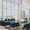Images of the concourse show high ceilings and floor-to-ceiling windows.
