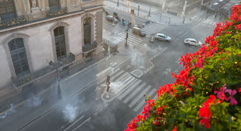A photo taken Oct. 17 from a room at the Hotel Regina Louvre adjacent to the museum showed tear gas rising from the streets.