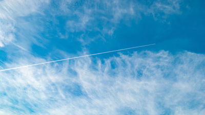 Contrails form when soot and water vapor emissions from jets mix with humid, cold air.