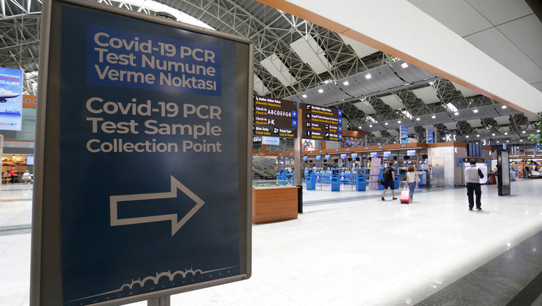 A sign points the way to the Covid-19 PCR testing center in the departures area at Sabiha Gokcen Airport in Istanbul.