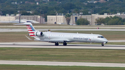 A Bombardier CRJ-900ER of Phoenix-based Mesa Airlines landing at San Antonio Airport. Mesa Air Group will cease operating regional flights for American Airlines on April 3 and is finalizing a new five-year deal with United Airlines.