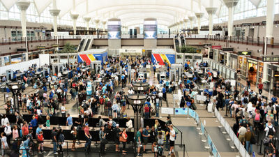 A large crowd at Denver International Airport.