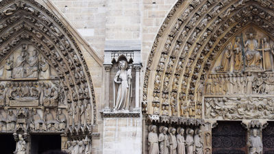 Carpenters are working to restore Notre Dame Cathedral as it was built in the Middle Ages.